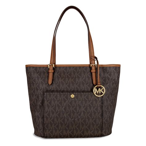 michael michael kors jet set item large snap pocket tote|Michael Kors bag with airplanes.